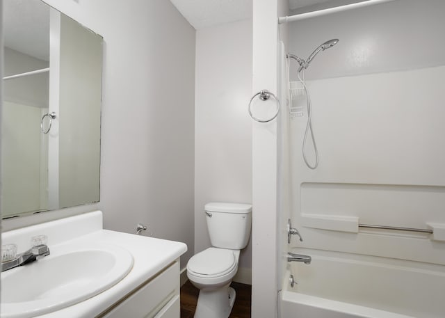 full bathroom with vanity, toilet, wood-type flooring, and shower / bathing tub combination