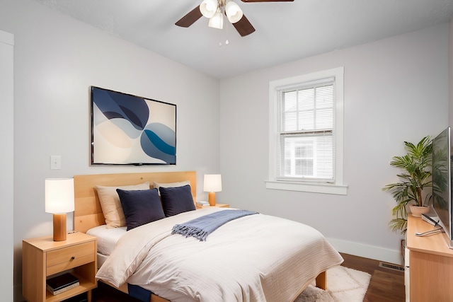 bedroom featuring ceiling fan and dark hardwood / wood-style flooring