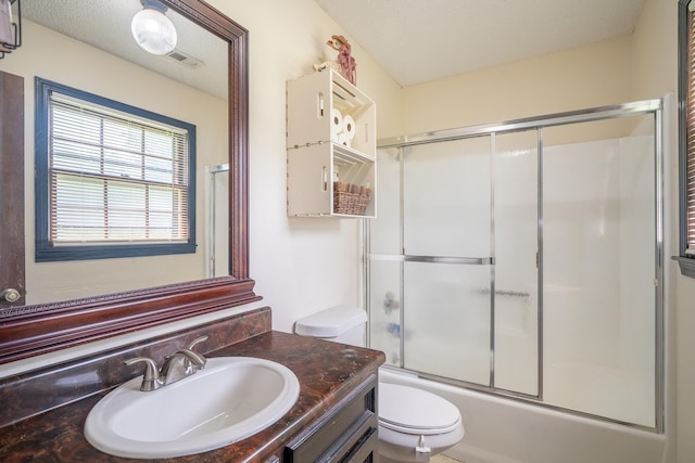  - bathroom featuring vanity and combined bath / shower with glass door