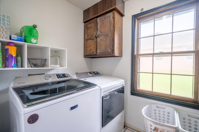  - laundry area featuring cabinet space and washer and dryer