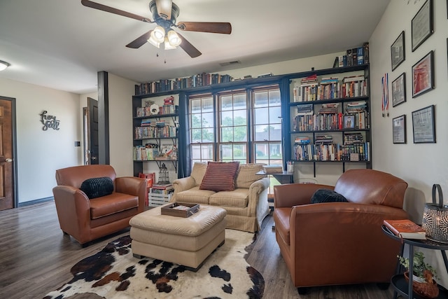  - sitting room with ceiling fan and wood finished floors