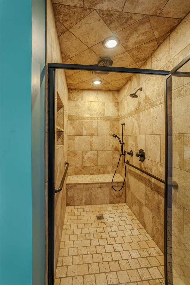 bathroom featuring tiled shower