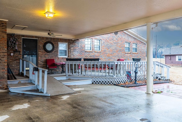 view of patio / terrace featuring ceiling fan and a deck