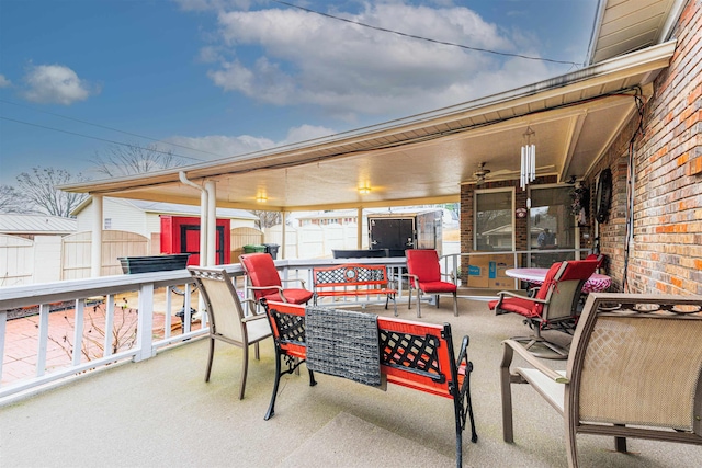 view of patio featuring a shed