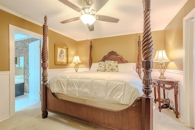 carpeted bedroom featuring crown molding, ceiling fan, and a textured ceiling