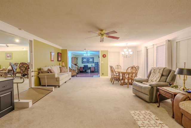 living room with ceiling fan with notable chandelier, ornamental molding, light carpet, and a textured ceiling