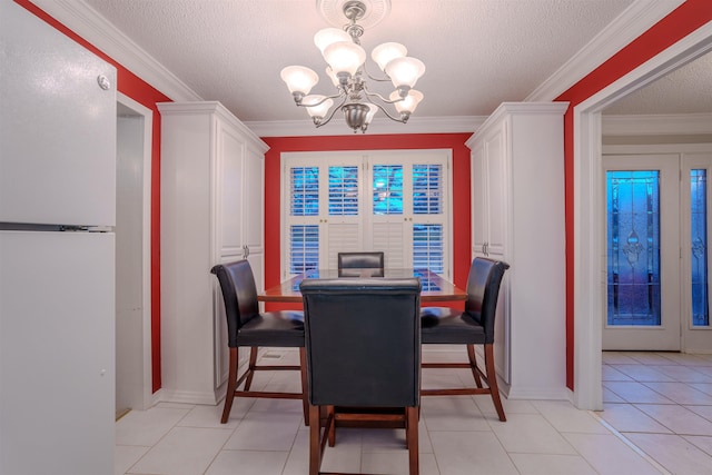 tiled dining area with crown molding, a textured ceiling, and a chandelier