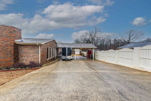 exterior space featuring a carport