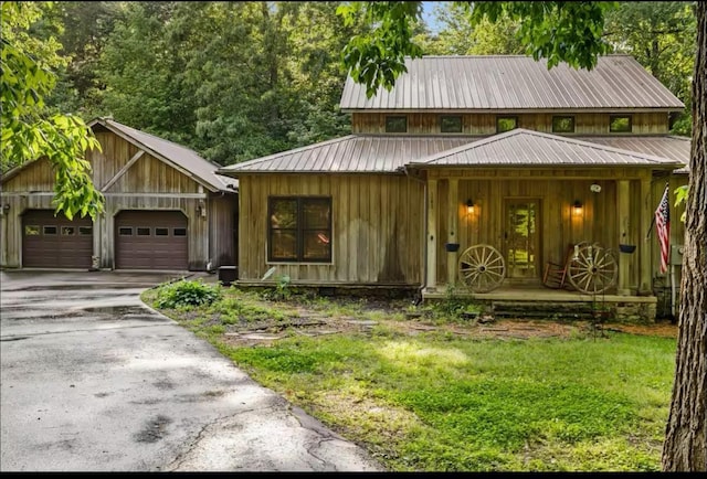 view of front of home with a porch and a garage