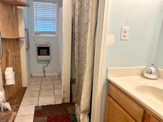 bathroom featuring tile patterned floors, heating unit, shower / tub combo with curtain, and vanity