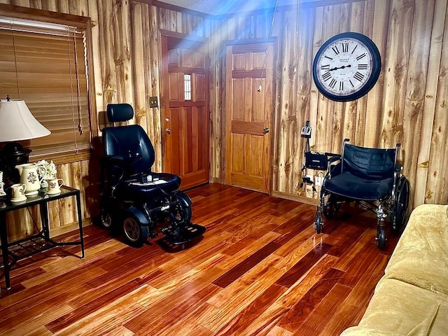 interior space featuring wood walls and hardwood / wood-style flooring