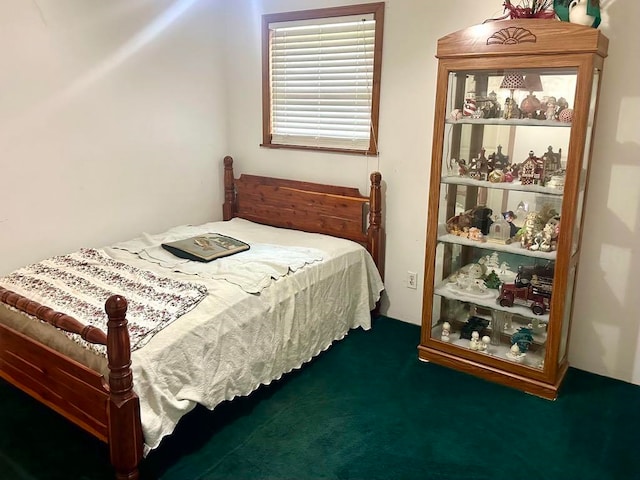 bedroom with dark colored carpet