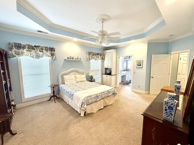 carpeted bedroom with ornamental molding, a raised ceiling, and ceiling fan