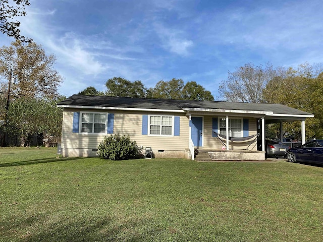 ranch-style house featuring a carport and a front yard