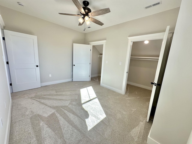 unfurnished bedroom with light colored carpet and ceiling fan