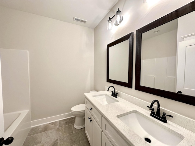 full bathroom with vanity, toilet, and shower / washtub combination