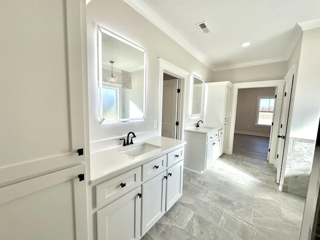 bathroom with vanity and crown molding