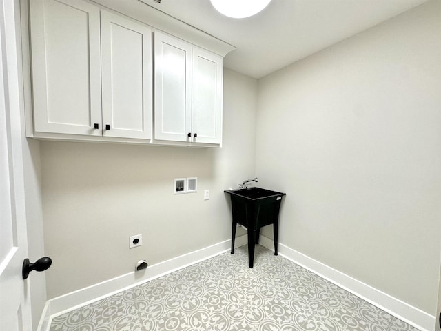 washroom with cabinets and washer hookup