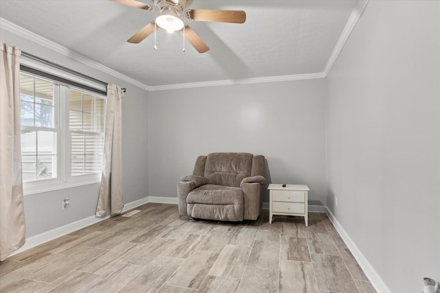  - sitting room featuring ornamental molding, wood finish floors, ceiling fan, and baseboards