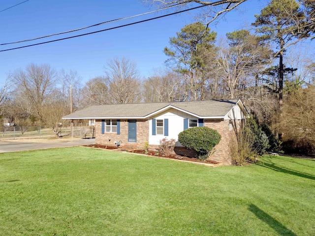 single story home with a front lawn and brick siding