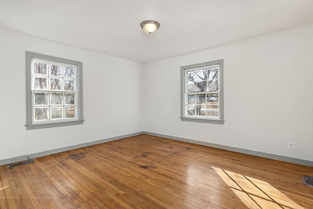 spare room featuring hardwood / wood-style floors