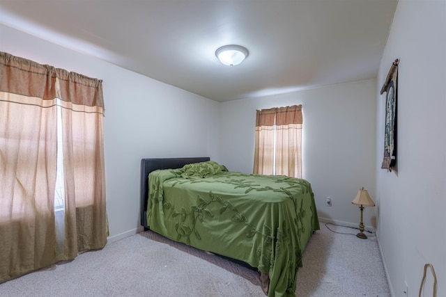  - carpeted bedroom with baseboards