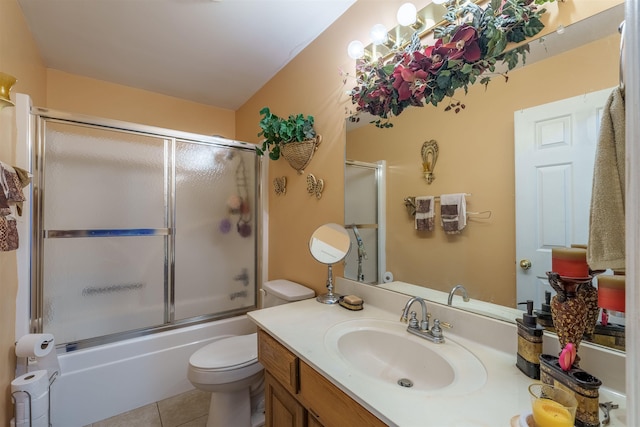  - full bathroom featuring vanity, tile patterned floors, and combined bath / shower with glass door
