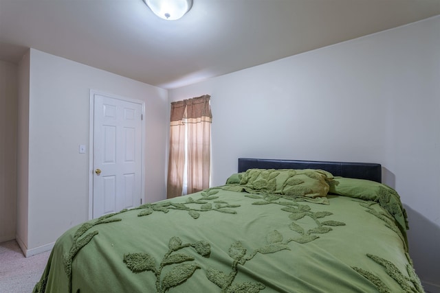  - bedroom featuring carpet and baseboards