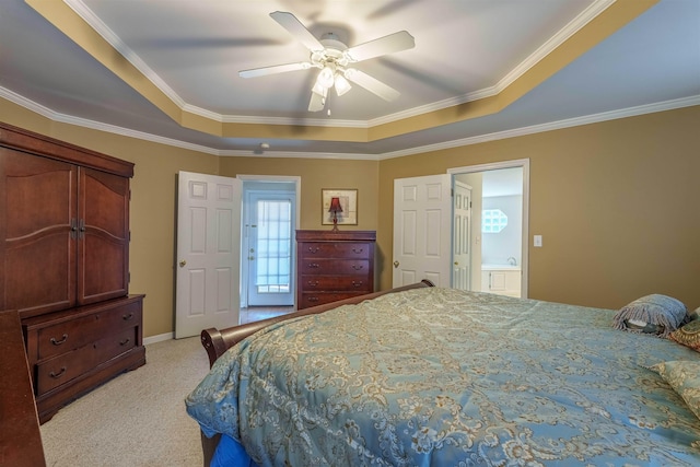  - bedroom featuring a raised ceiling, light colored carpet, crown molding, and a ceiling fan