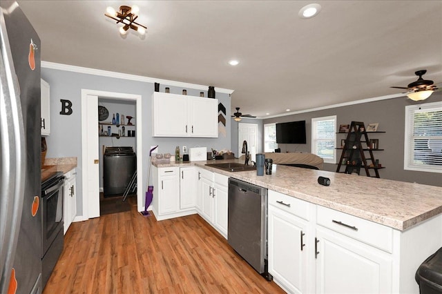 kitchen featuring white cabinets, sink, crown molding, and stainless steel appliances