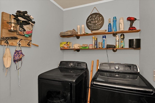 clothes washing area with washer and dryer and ornamental molding