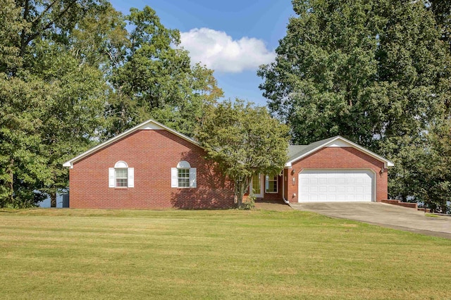 view of front facade with a front yard and a garage