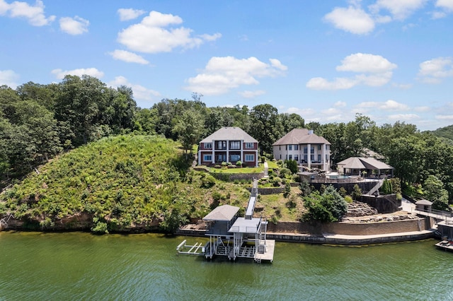 rear view of property featuring a water view