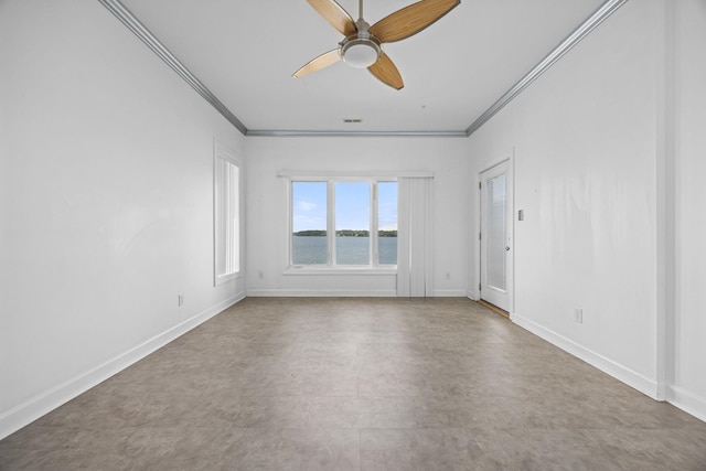 spare room with ceiling fan and crown molding