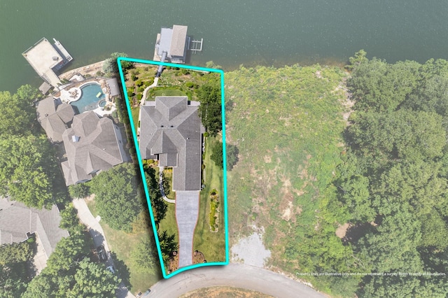 birds eye view of property featuring a water view