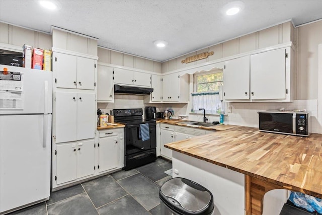 kitchen featuring wood counters, white cabinets, black range with electric stovetop, sink, and white fridge