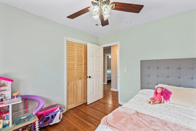 bedroom featuring a closet, ceiling fan, and dark wood-type flooring