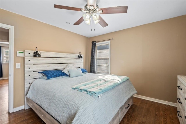 bedroom featuring dark hardwood / wood-style flooring and ceiling fan