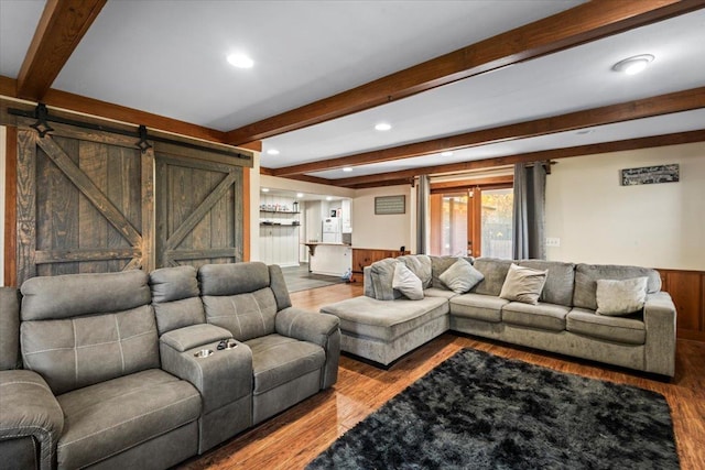 living room featuring french doors, wooden walls, wood-type flooring, beamed ceiling, and bar area