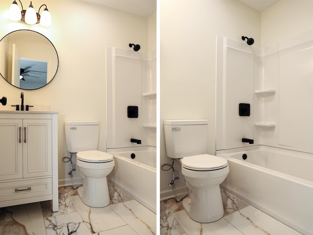 bathroom featuring vanity, toilet, marble finish floor, and washtub / shower combination