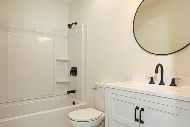 bathroom featuring vanity, toilet, and shower / bathtub combination