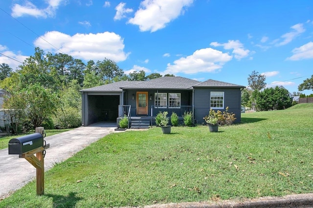 view of front of house featuring a carport, covered porch, and a front yard