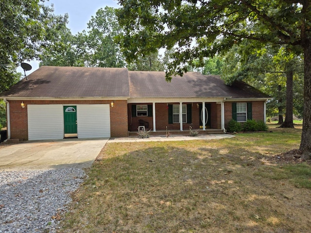 ranch-style house with a front yard, a porch, and a garage