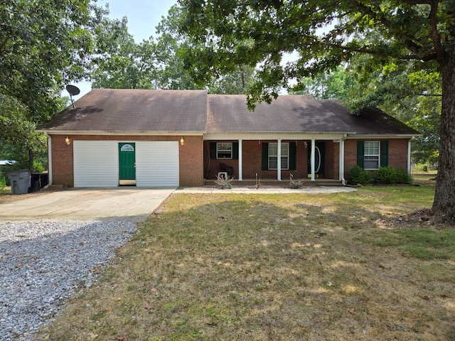 ranch-style house featuring a garage and a front lawn