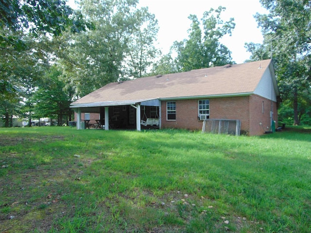 back of house with a yard