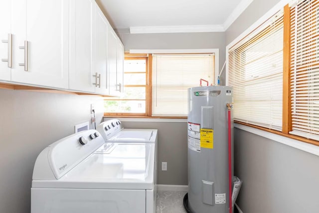 washroom featuring cabinet space, washing machine and dryer, water heater, baseboards, and ornamental molding