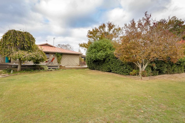 view of yard with a wooden deck