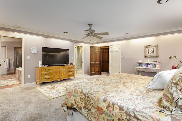 bedroom featuring connected bathroom, light colored carpet, ceiling fan, and ornamental molding