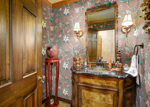 bathroom with tile patterned floors, vanity, and crown molding