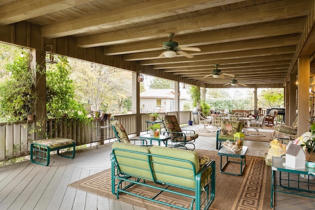 wooden terrace featuring an outdoor living space and ceiling fan